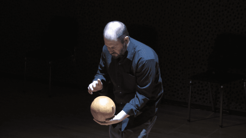 Man playing digital instrument.