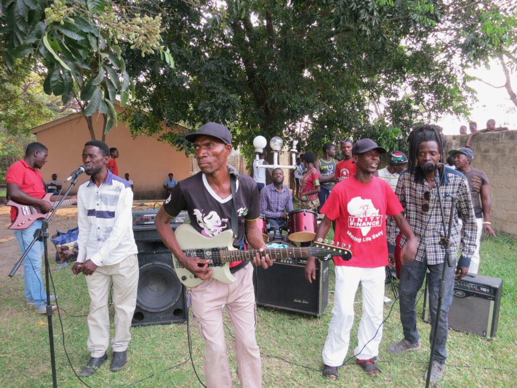 Group of men playing instruments.